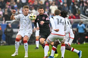 Jan 22, 2024; Dallas, TX, USA; Inter Miami forward Lionel Messi (10) attempts to move the ball past FC Dallas midfielder Liam Fraser (18) and midfielder Asier Illarramendi (14)  during the first half at Cotton Bowl Stadium. Mandatory Credit: Jerome Miron-USA TODAY Sports