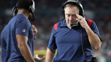 MIAMI GARDENS, FLORIDA - JANUARY 09: Head coach Bill Belichick of the New England Patriots walks the sidlines in the fourth quarter of the game against the Miami Dolphins at Hard Rock Stadium on January 09, 2022 in Miami Gardens, Florida.   Mark Brown/Get